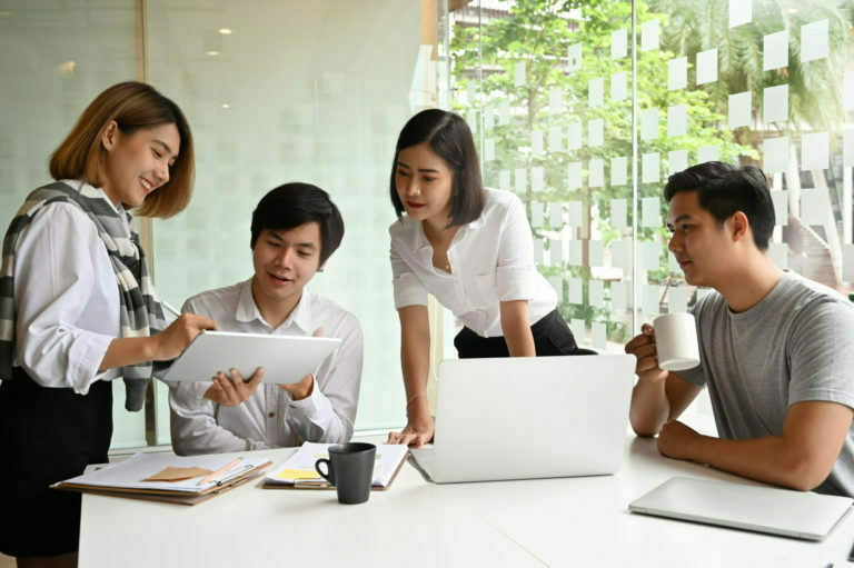 Motivated startup business meeting on modern office table.