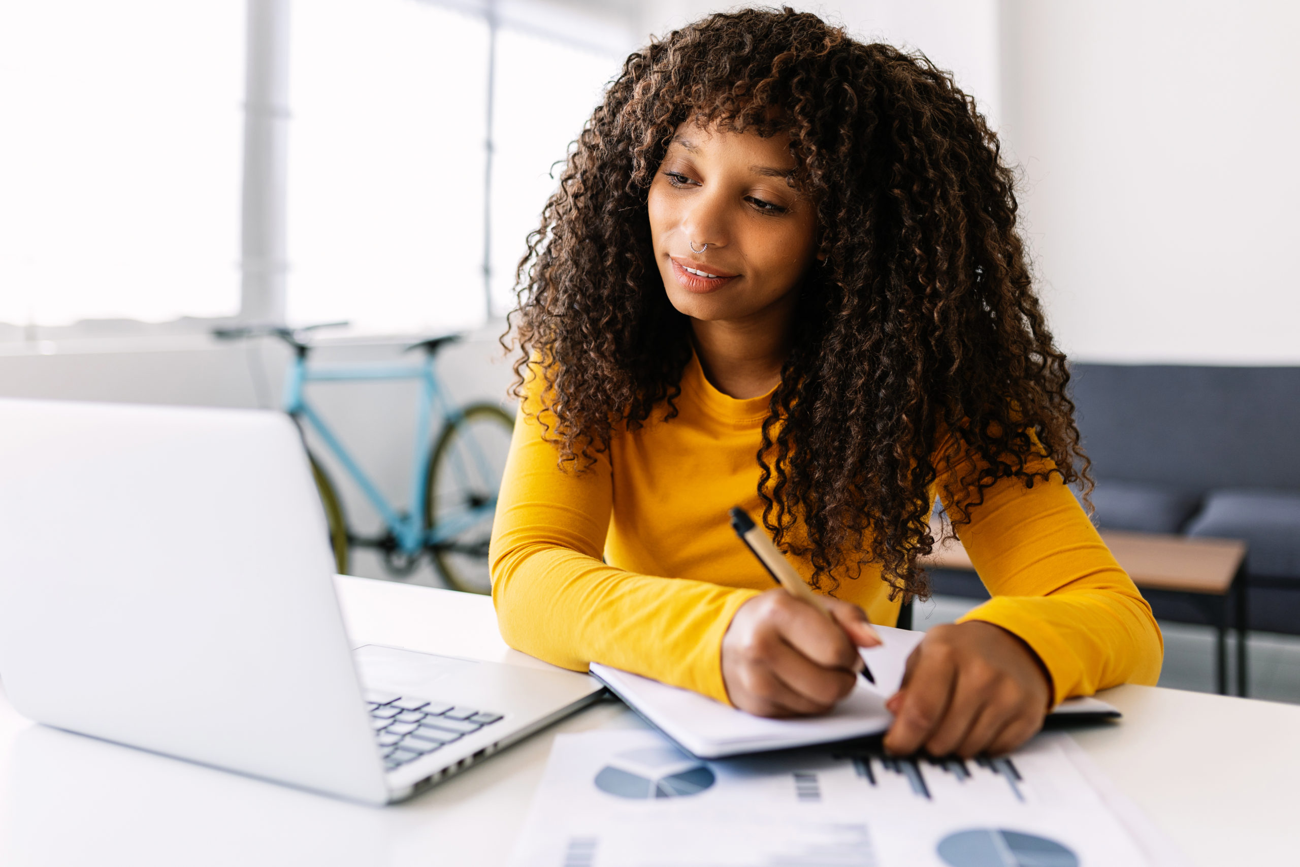 Young businesswoman working on laptop from home office